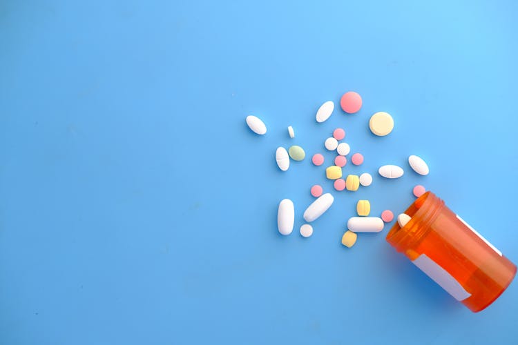 Medicine Pills On The Blue Background