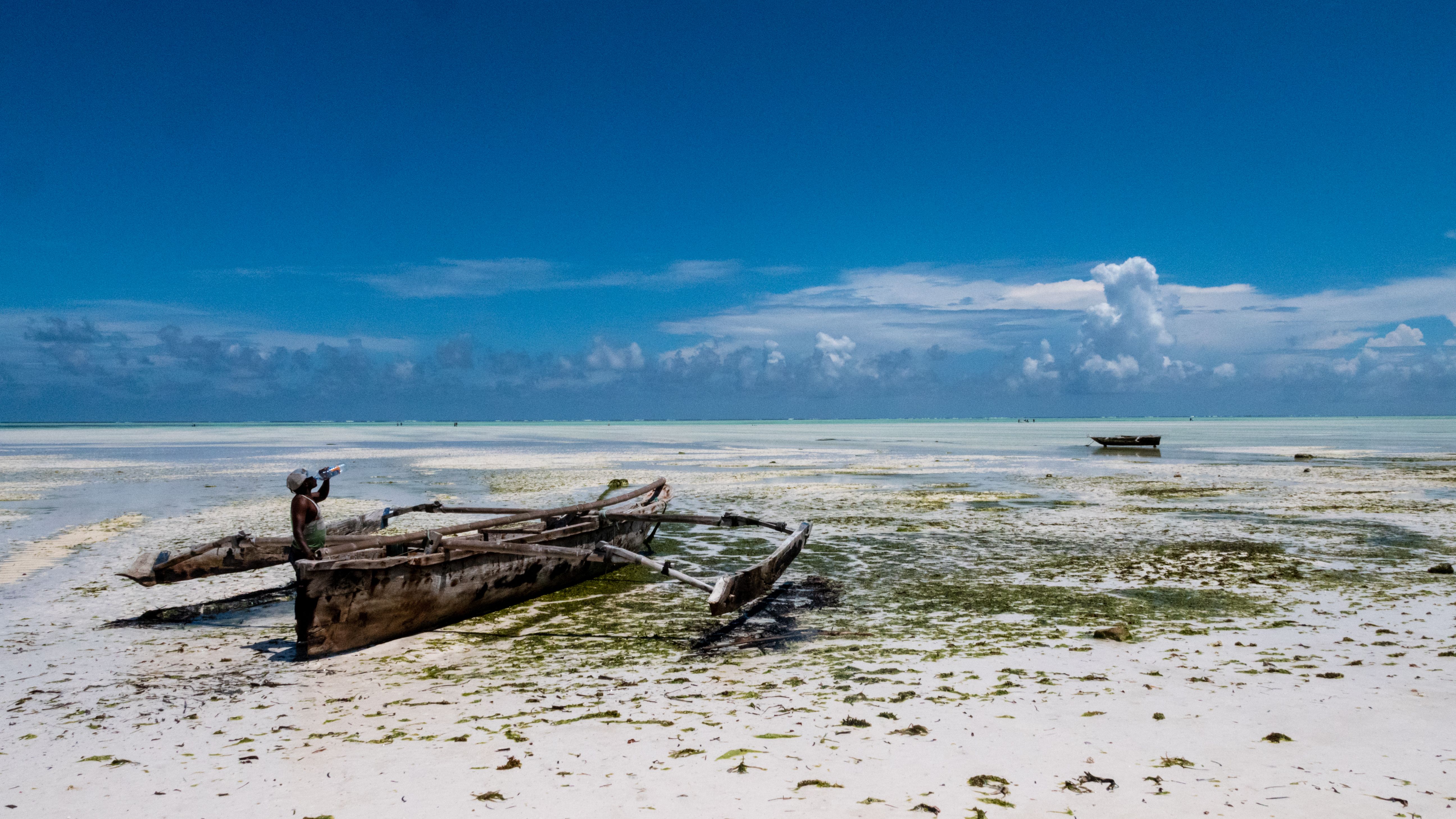 Brown Wooden Boat on White Sand · Free Stock Photo