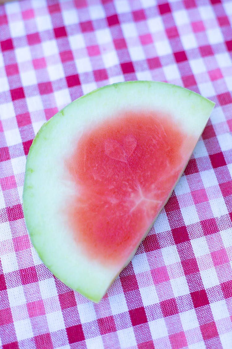 Slice Of A Watermelon On A Checker Tablecloth 