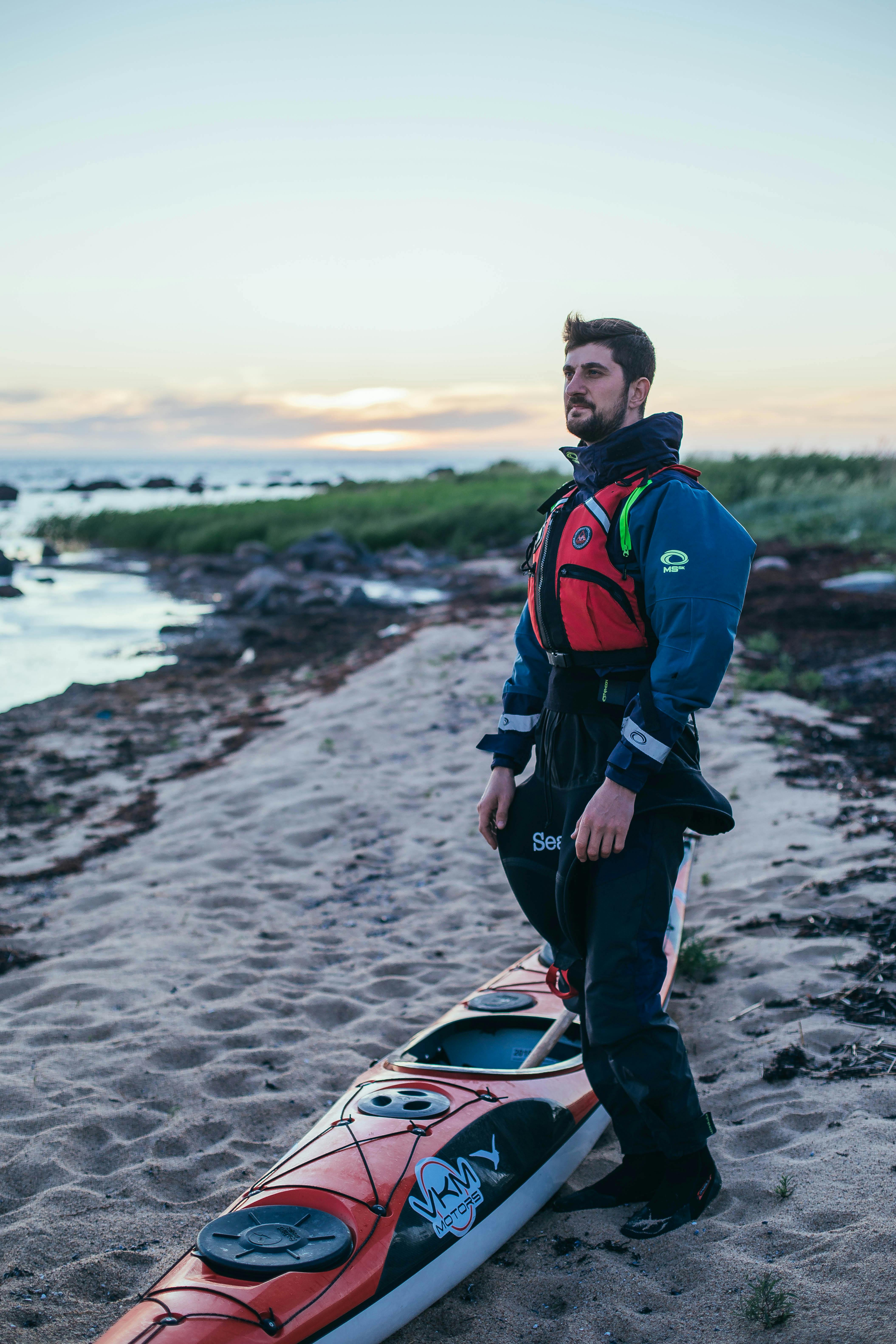 Man in Costume with Kayak on Beach · Free Stock Photo