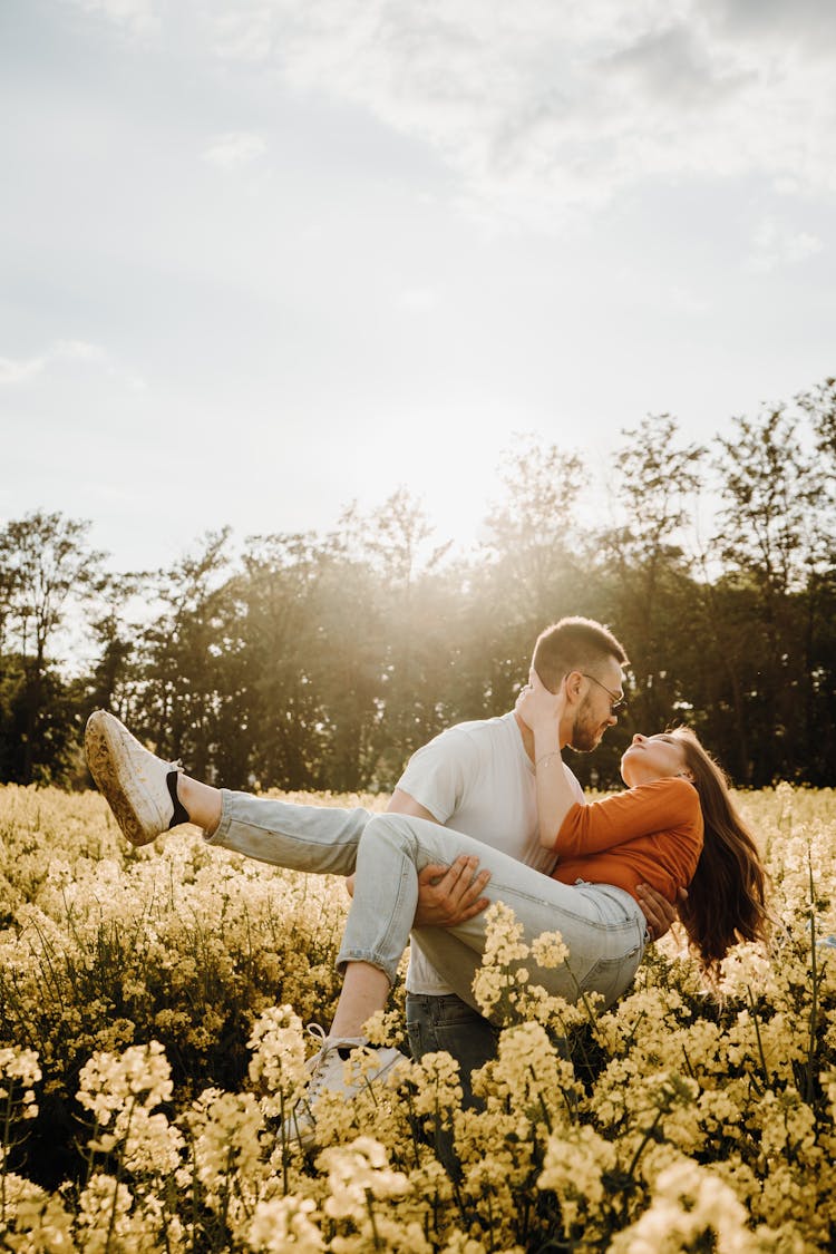 Couple Kissing In A Grapeseed Field