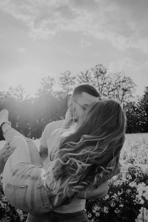 Young Couple Kissing in Nature