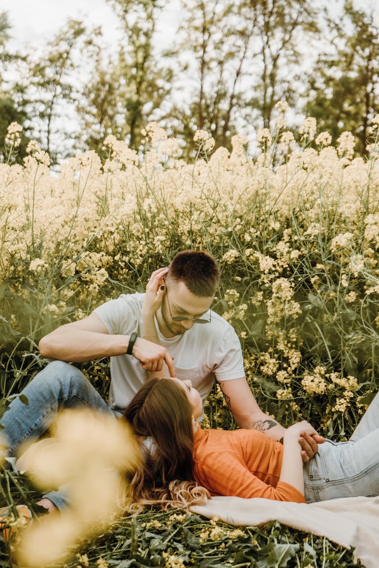 Romantic Couple In A Meadow At Summer 