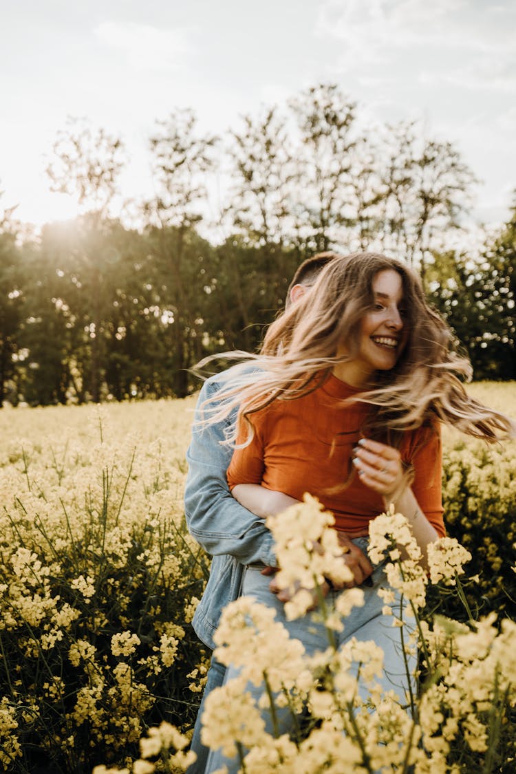 Man Embracing Woman From Behind 