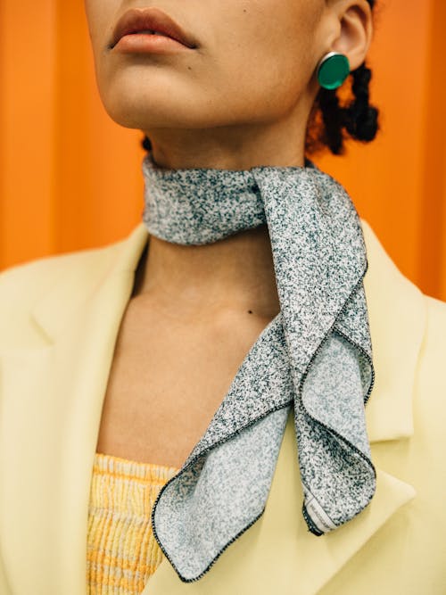 A Woman in Yellow Blazer Wearing a Gray Scarf