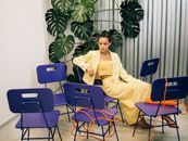 Woman in Yellow Sweater Sitting on Chair