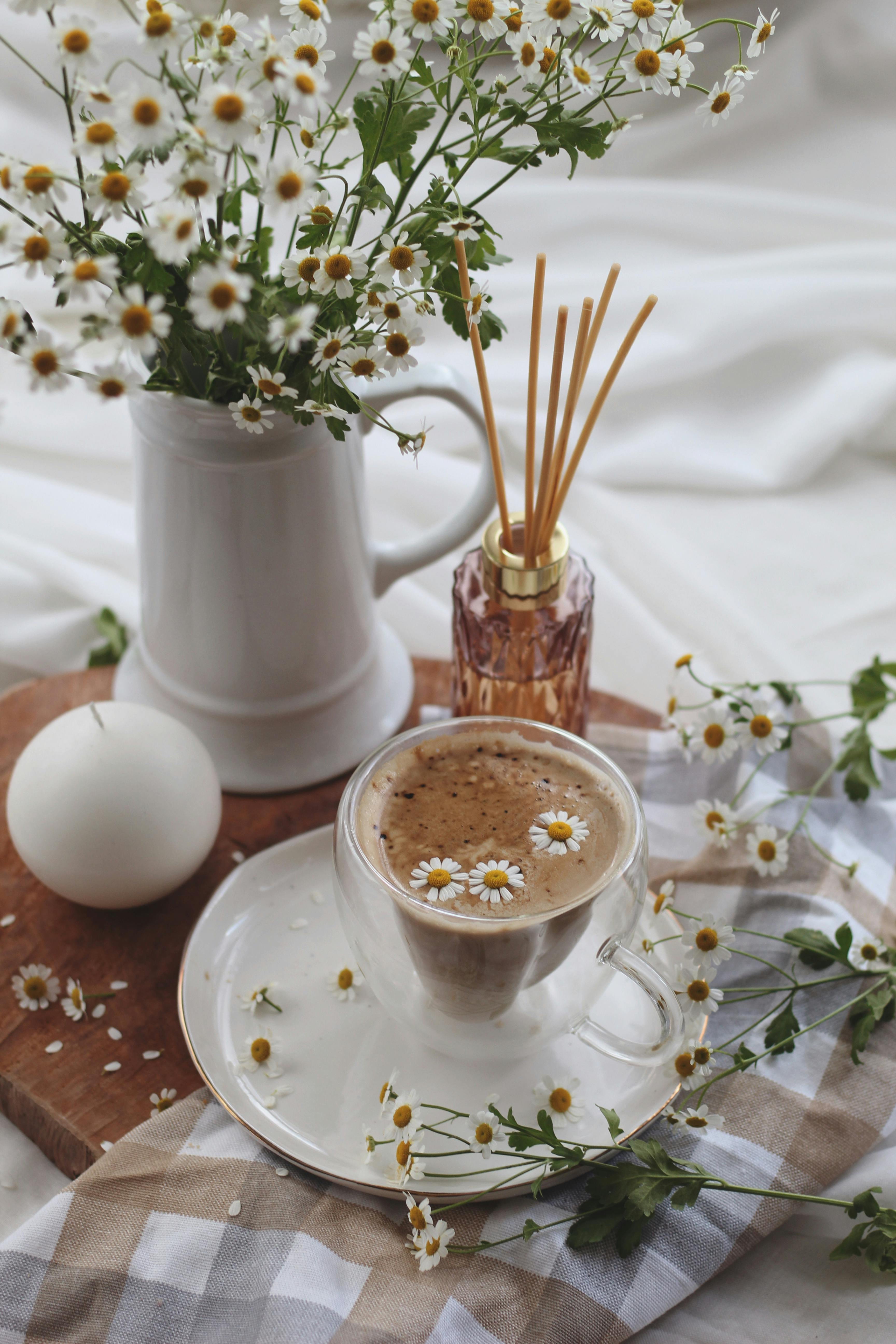 coffee and vase with flowers