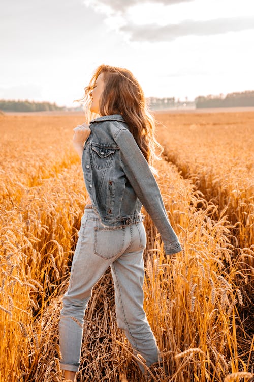 Long Haired Woman Walking in a Field