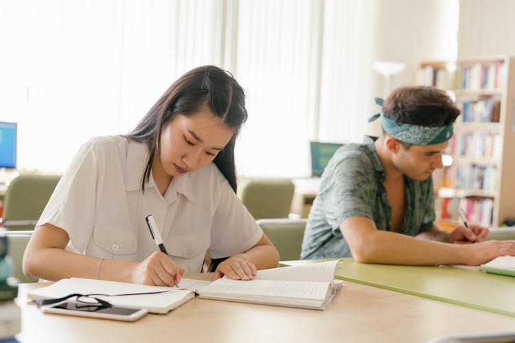 Man And Woman In The Library