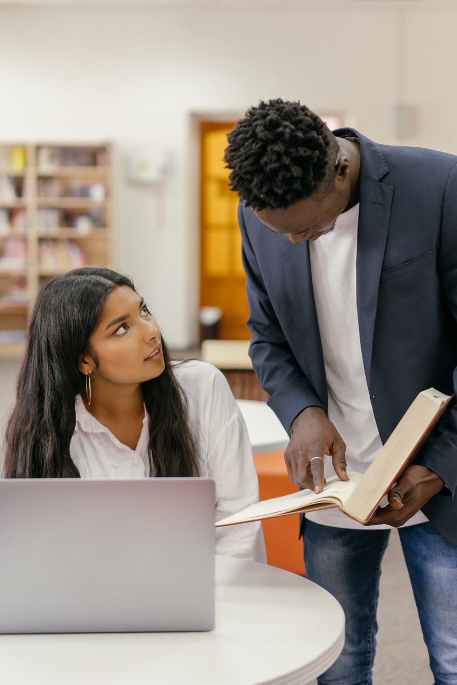 Student reviewing choices and notes on a laptop