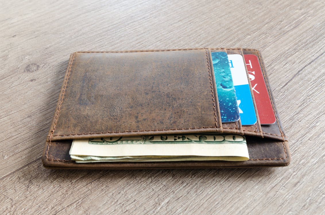 Free Brown Leather Wallet and Us Dollar Banknote Stock Photo