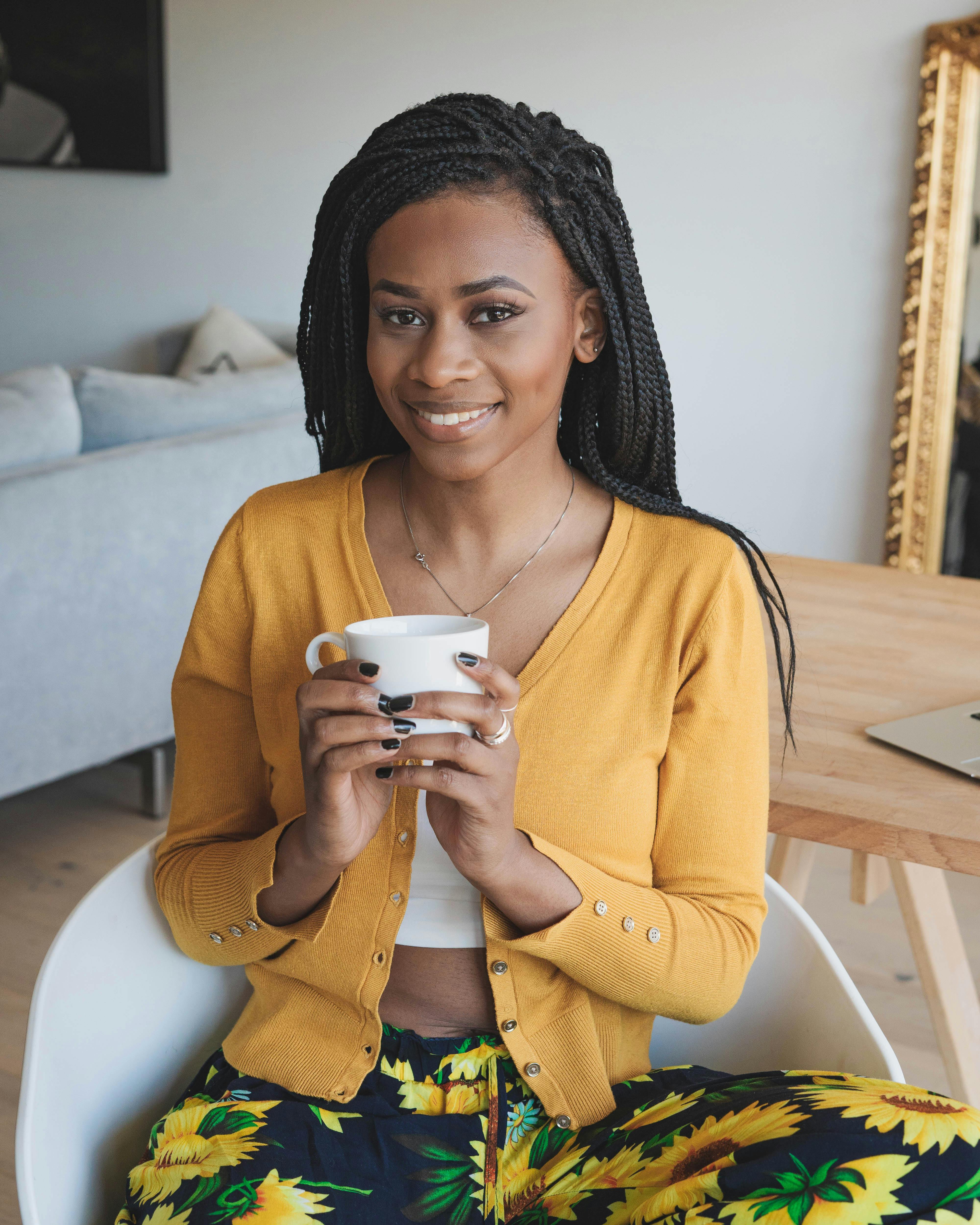 Woman in Yellow Cardigan Holding White Ceramic Mug