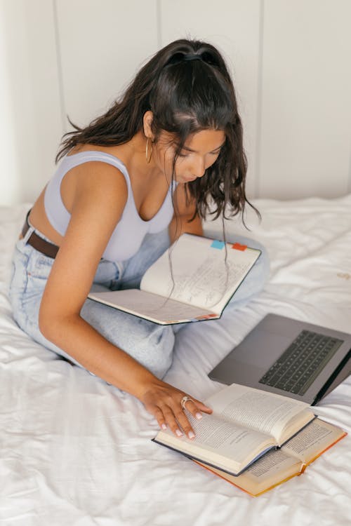 Free A Woman Doing Her Homework Stock Photo