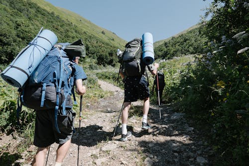 Two People Hiking on a Mountain