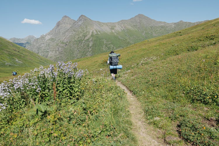 A Person Carrying Backpack Going Hiking 