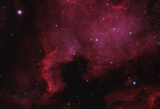 Capture of the North America Nebula's vibrant colors and stars in the universe.