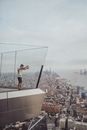 Man Standing on Top of Building