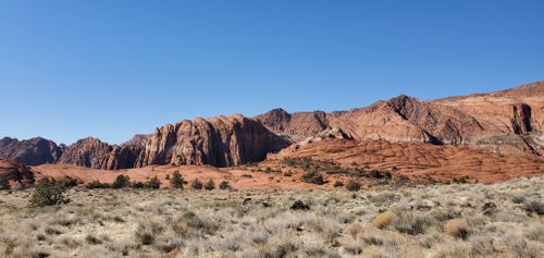 Free Breathtaking view of red rock formations under a clear sky in a desert landscape. Stock Photo