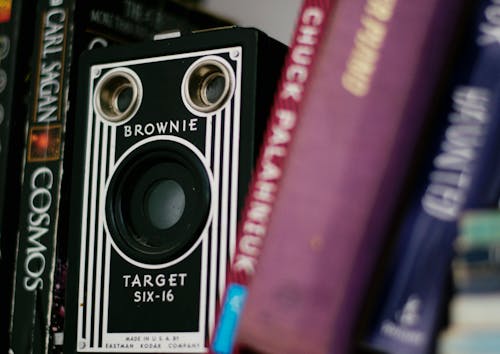 A Vintage Kodak Camera Between Books 