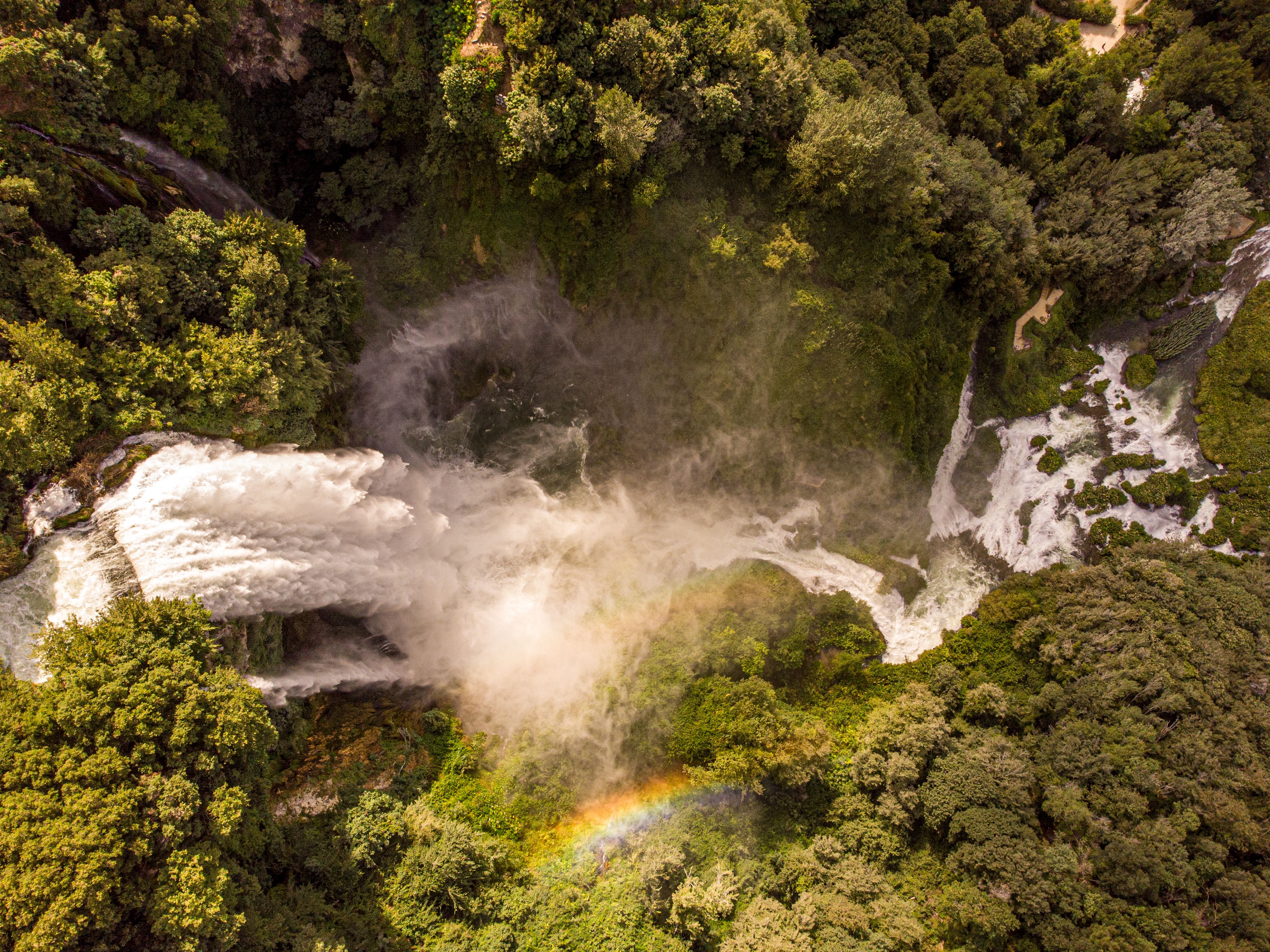 Wli Waterfalls mist and rainbow at base