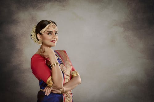 Free Woman in Red Sari Dress and Golden Jewelry Stock Photo