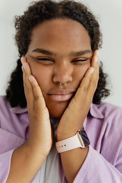 Woman Touching Her Face 