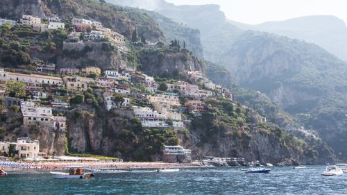 Free Beautiful hillside town of Positano on the Amalfi Coast with colorful houses and boats. Stock Photo