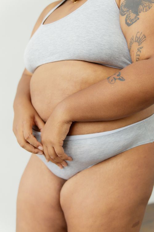 Free Empowering image of a plus-size woman embracing body positivity in lingerie. Stock Photo