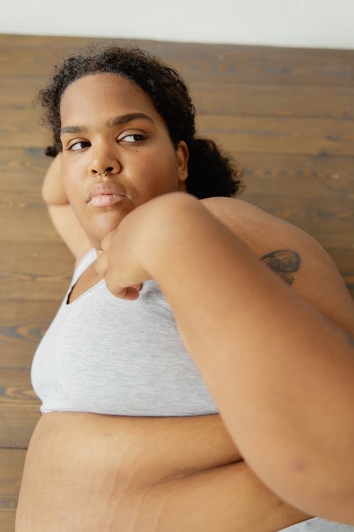 A Woman Wearing Gray Bra