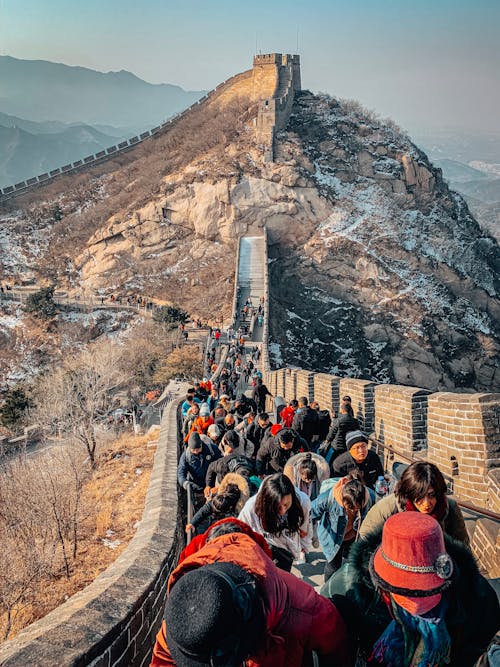 Free Tourists Walking on the Great Wall of China Stock Photo
