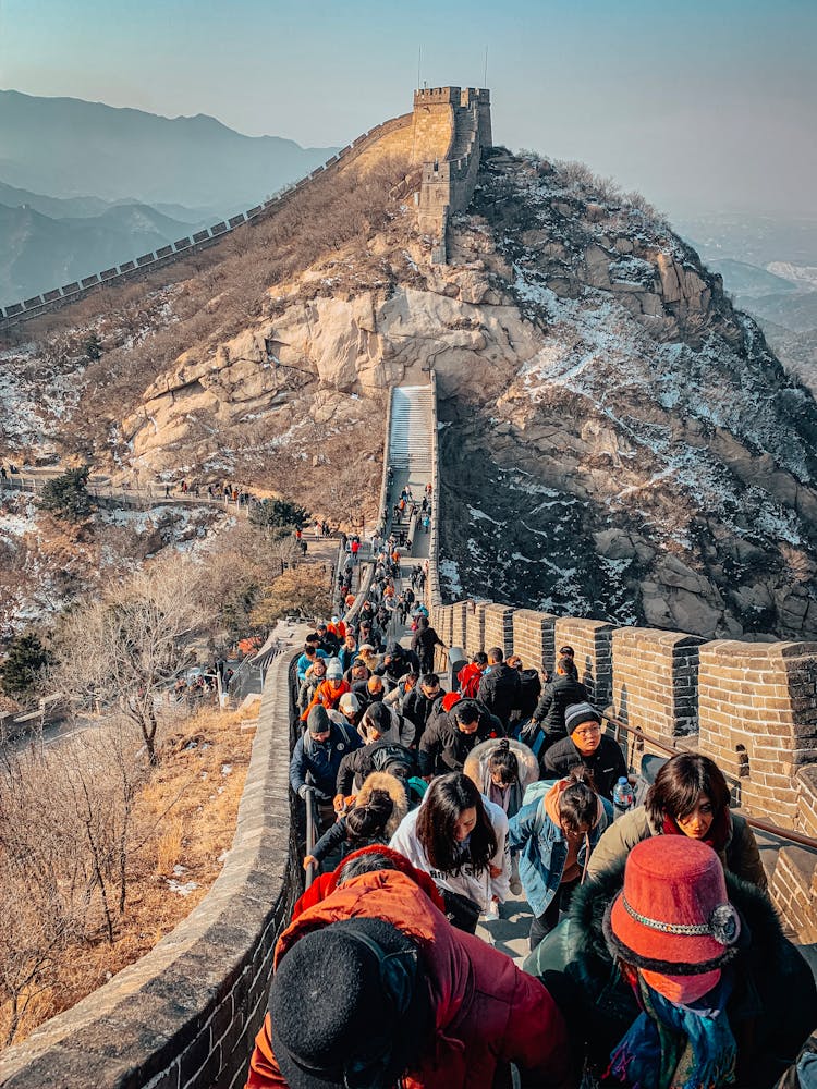 Tourists Walking On The Great Wall Of China