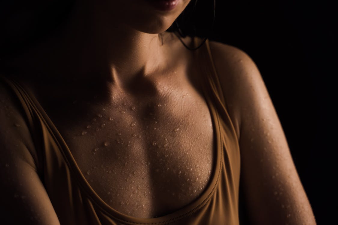 Close Up Photo of Wet Chest of a Woman 