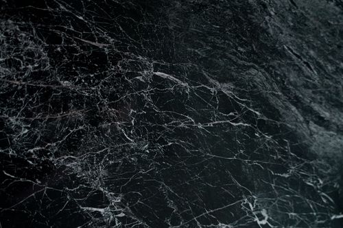 Free Intricate pattern on a dark marble surface, showcasing natural veins and textures. Stock Photo