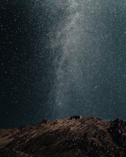 Free Photo of Mountain under Starry Night Sky Stock Photo