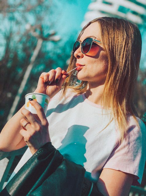 A Woman Eating an Ice Cream in a Cup