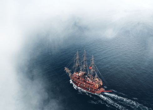 View of Sailing Historical Tall Ship from Above Clouds
