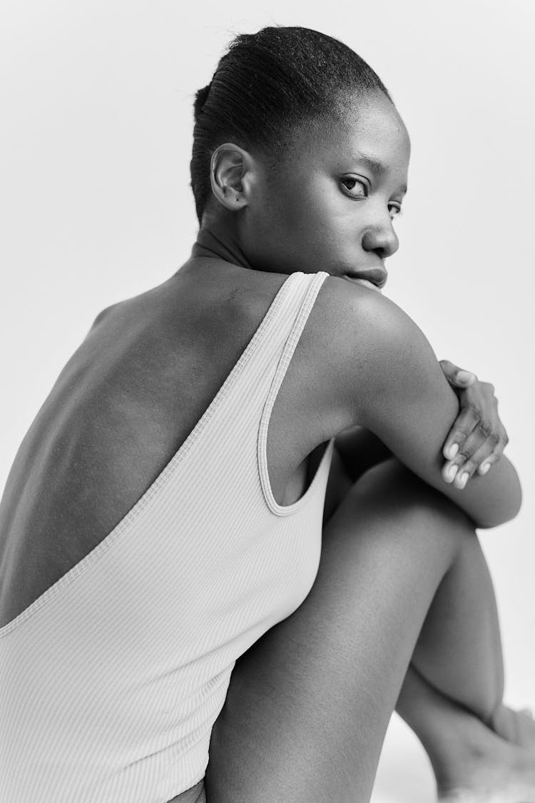 A Woman Wearing A Sleeveless Backless Shirt