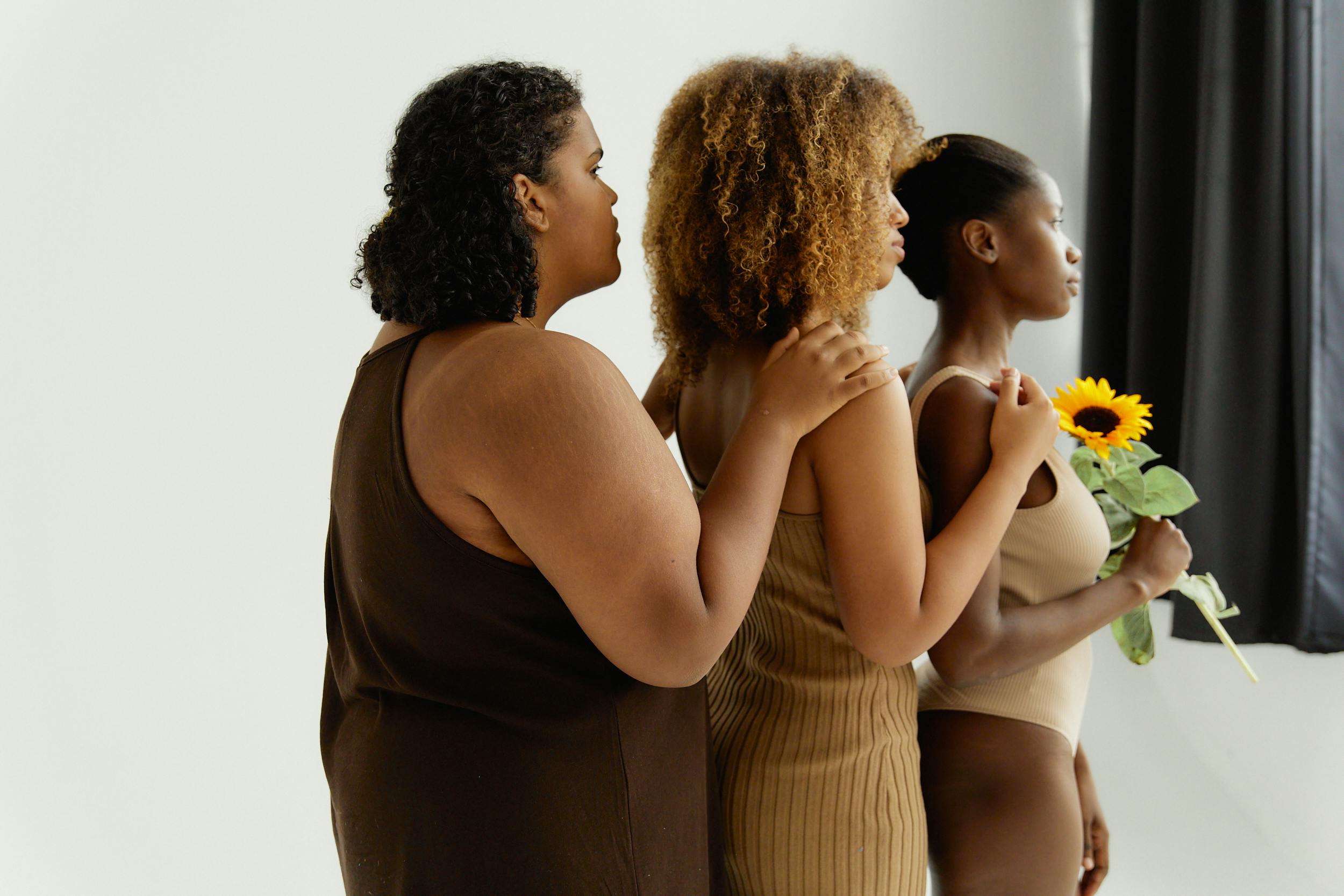 women in sleeveless shirts lined up