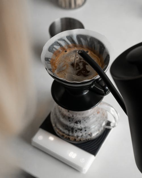 Free Coffee Being Brewed in a Coffee Maker Stock Photo