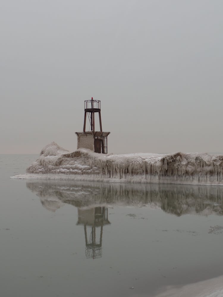 Signal Tower Standing On Seashore In Winter