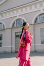 A Woman Wearing Fuchsia Pink Suit