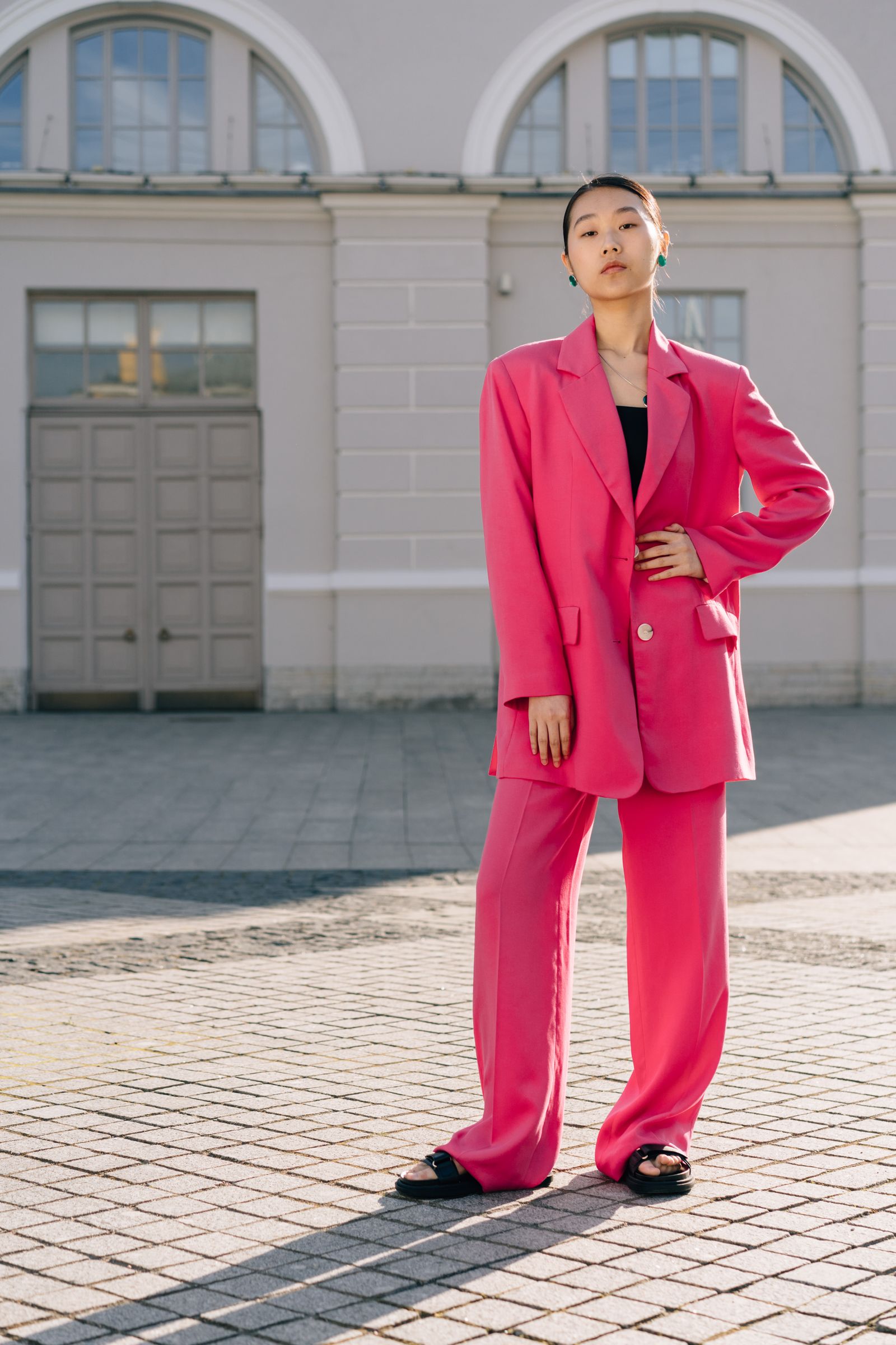 Woman in a statement blazer with matching pants in a colorful suit