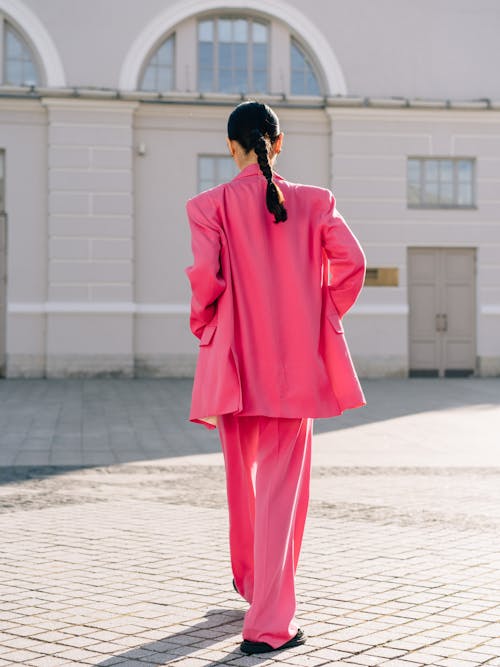 Back View of Woman in Pink Suit