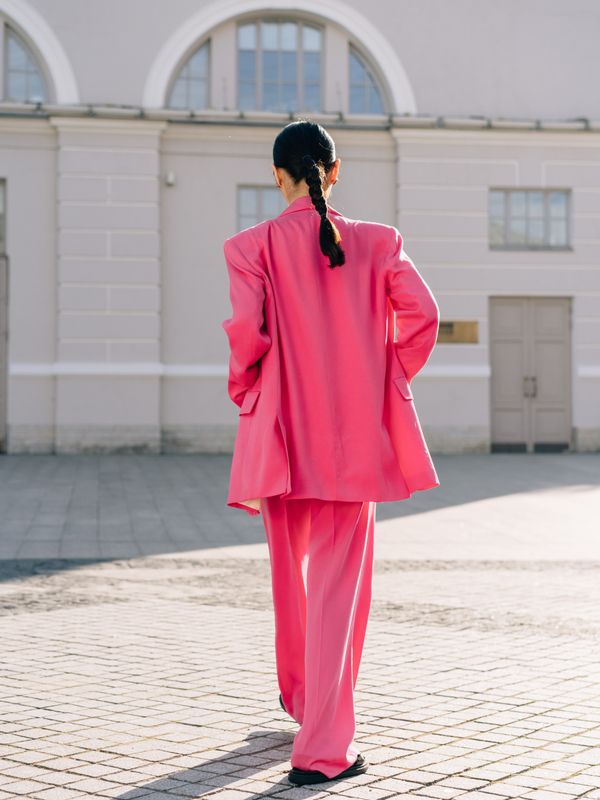 Woman in an oversized blazer over leggings