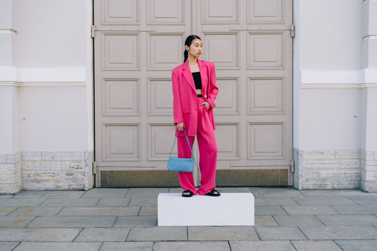 A stylish woman in wide-leg trousers