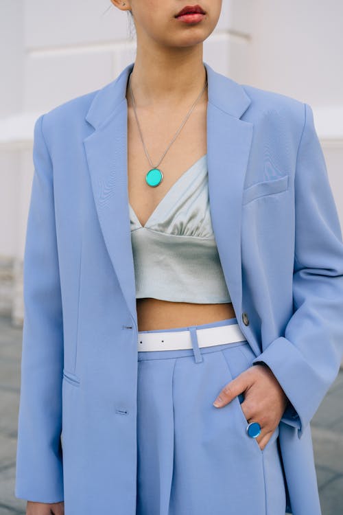 A Woman in Blue Suit and Gray Crop top