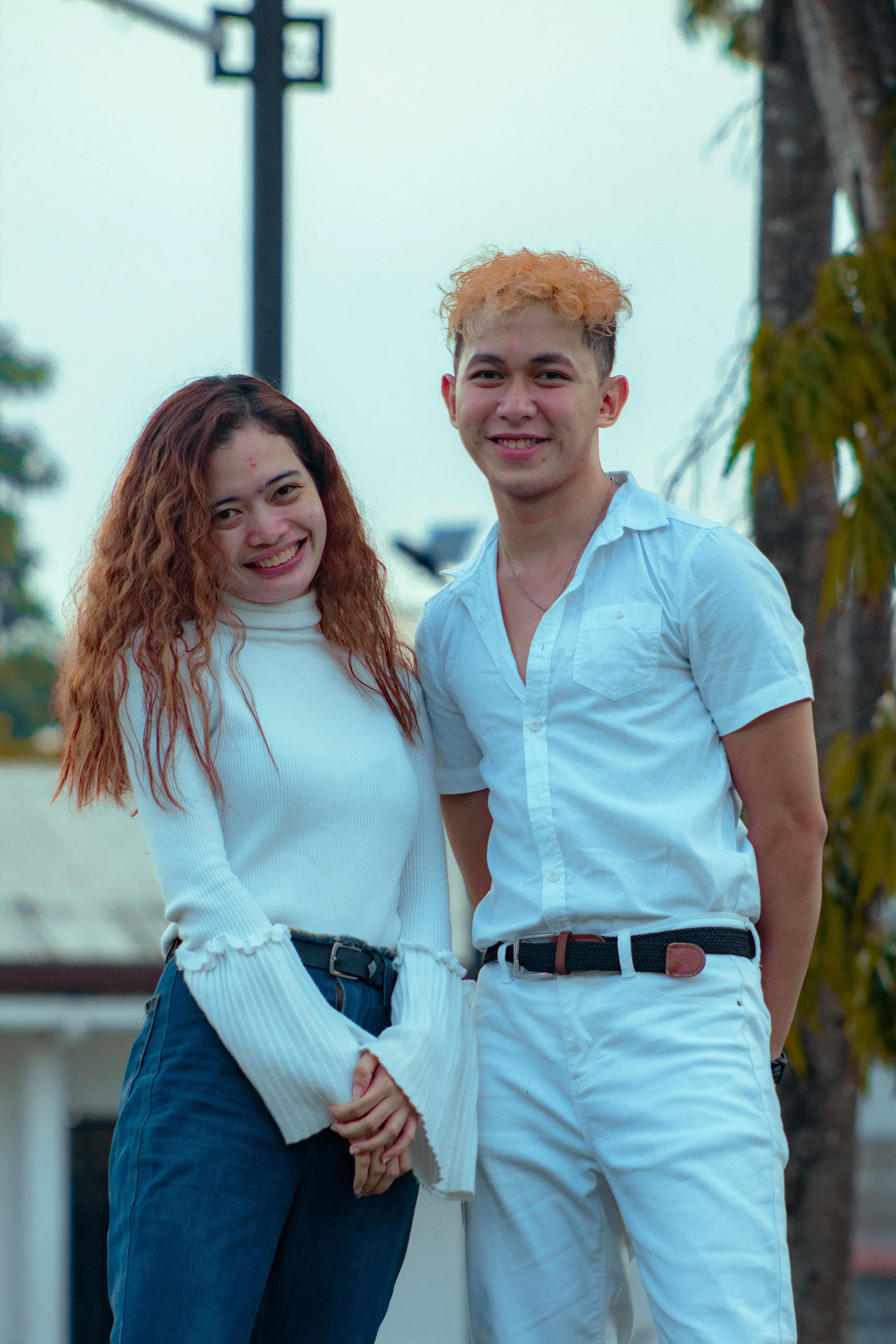 man and woman wearing white top