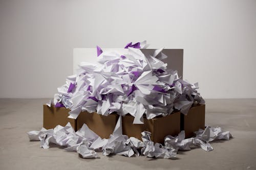 Paper Airplanes on Brown Cardboard Box