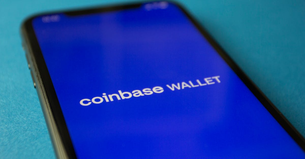 Close-up of a smartphone showing the Coinbase Wallet app interface for cryptocurrency transactions.