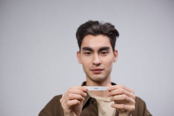 A Man Holding a Paper